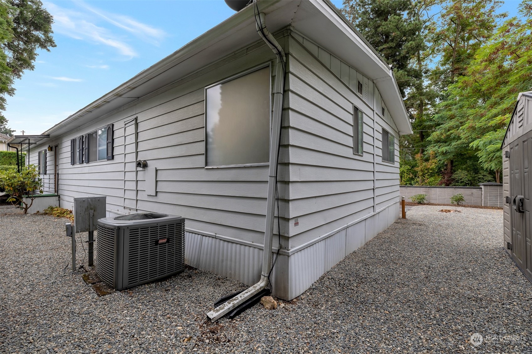 1121 244th Street Southwest, Unit 1 Bothell, WA 98021 - Photo 4 of 25 a view of backyard with washer and dryer