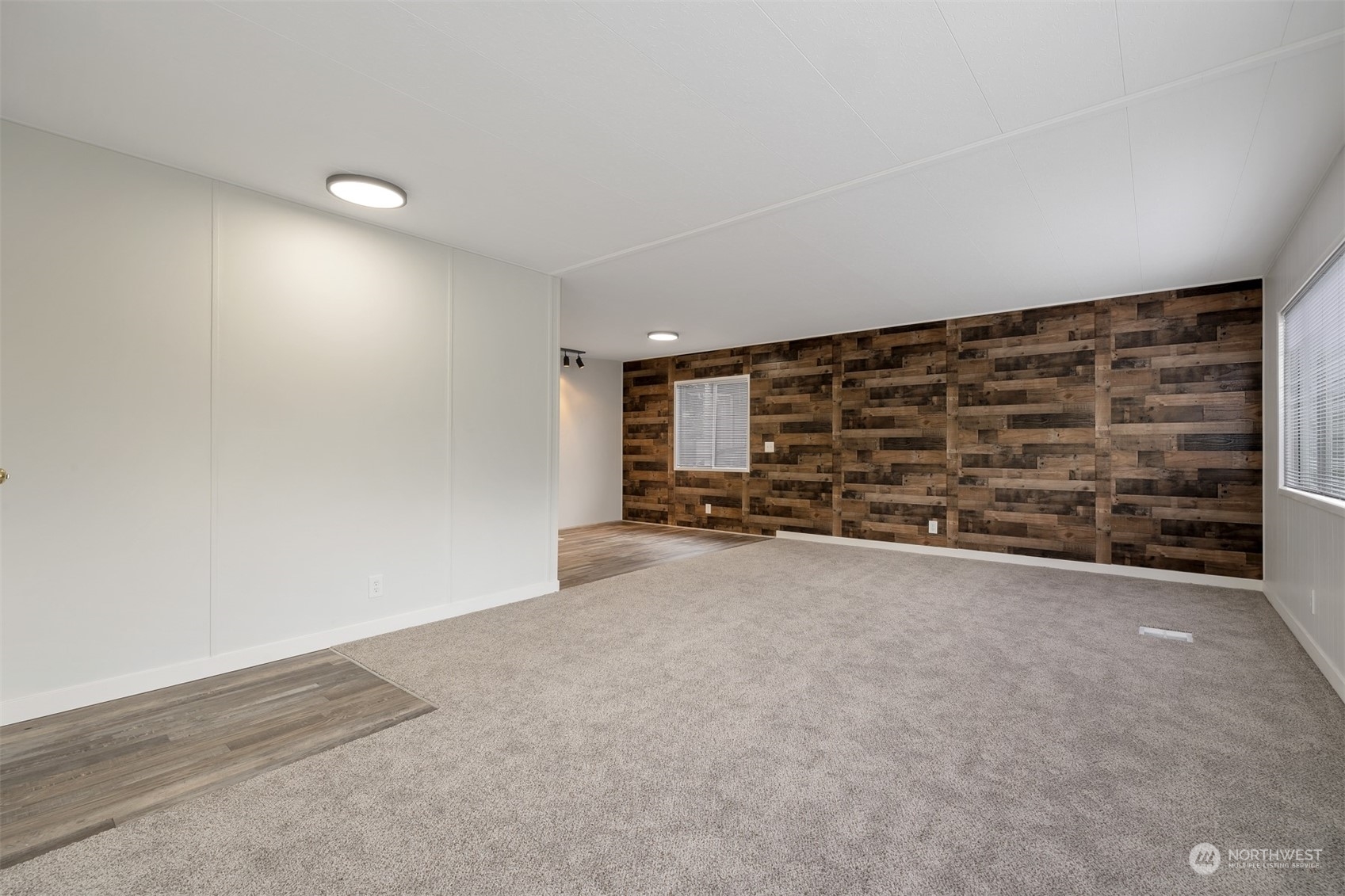 1121 244th Street Southwest, Unit 1 Bothell, WA 98021 - Photo 6 of 25 a view of an empty room with a empty space