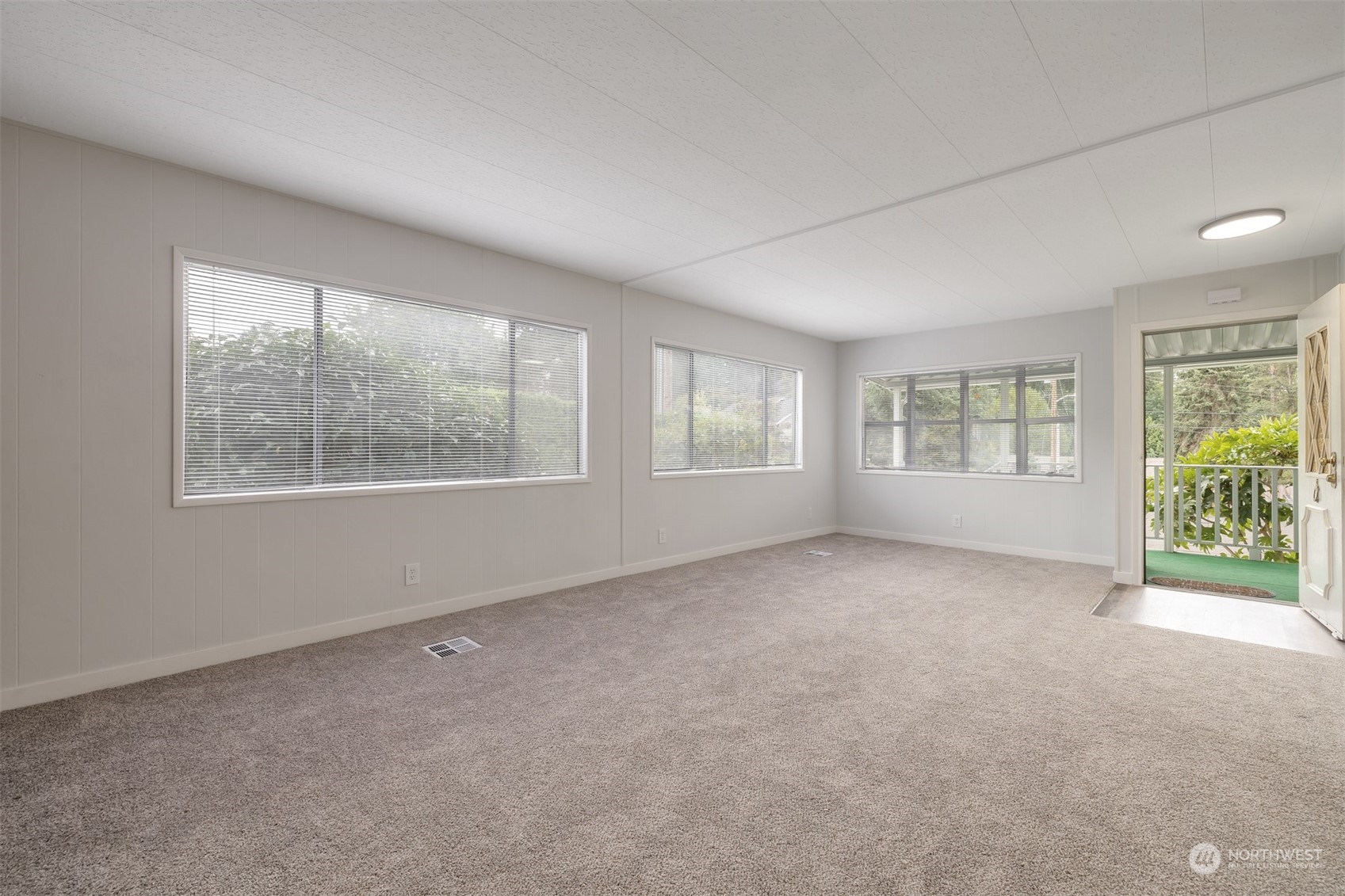 1121 244th Street Southwest, Unit 1 Bothell, WA 98021 - Photo 7 of 25 an empty room with windows