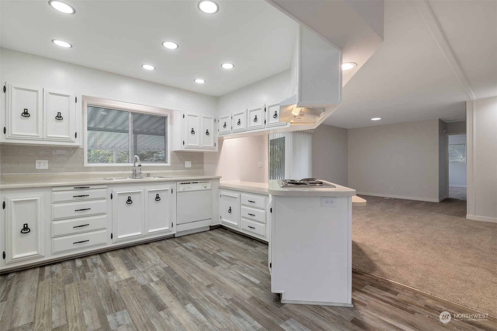 1121 244th Street Southwest, Unit 1 Bothell, WA 98021 - Photo 10 of 25 a kitchen with cabinets oven and a dishwasher