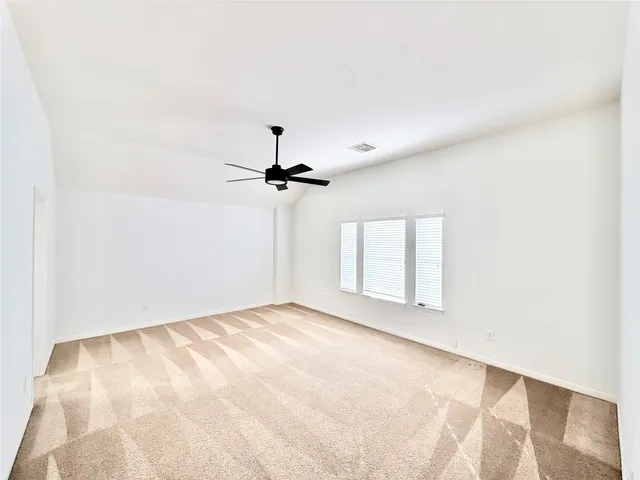 a view of empty room with windows