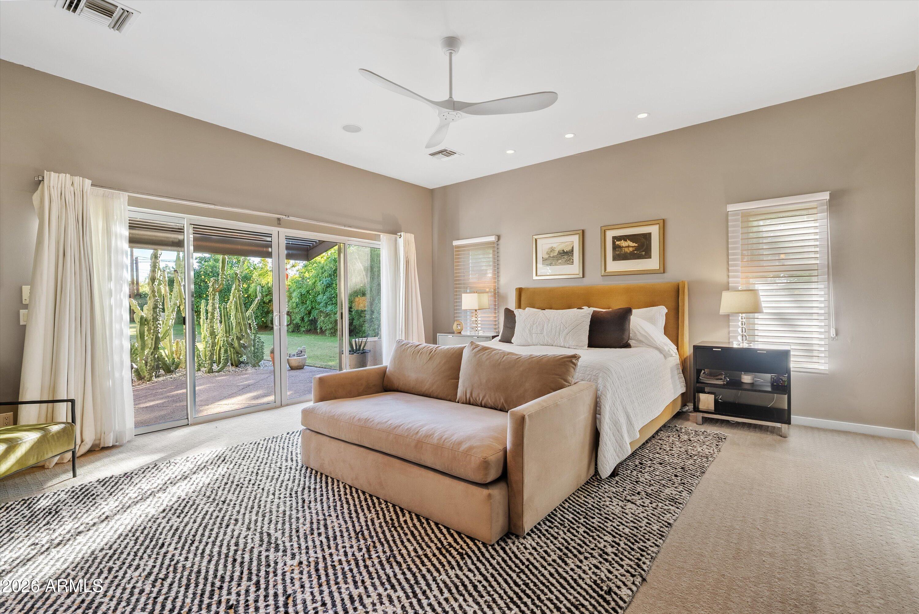 2933 East Pierson Street Phoenix, AZ 85016 - Photo 11 of 28 a bed room with a bed and a couch