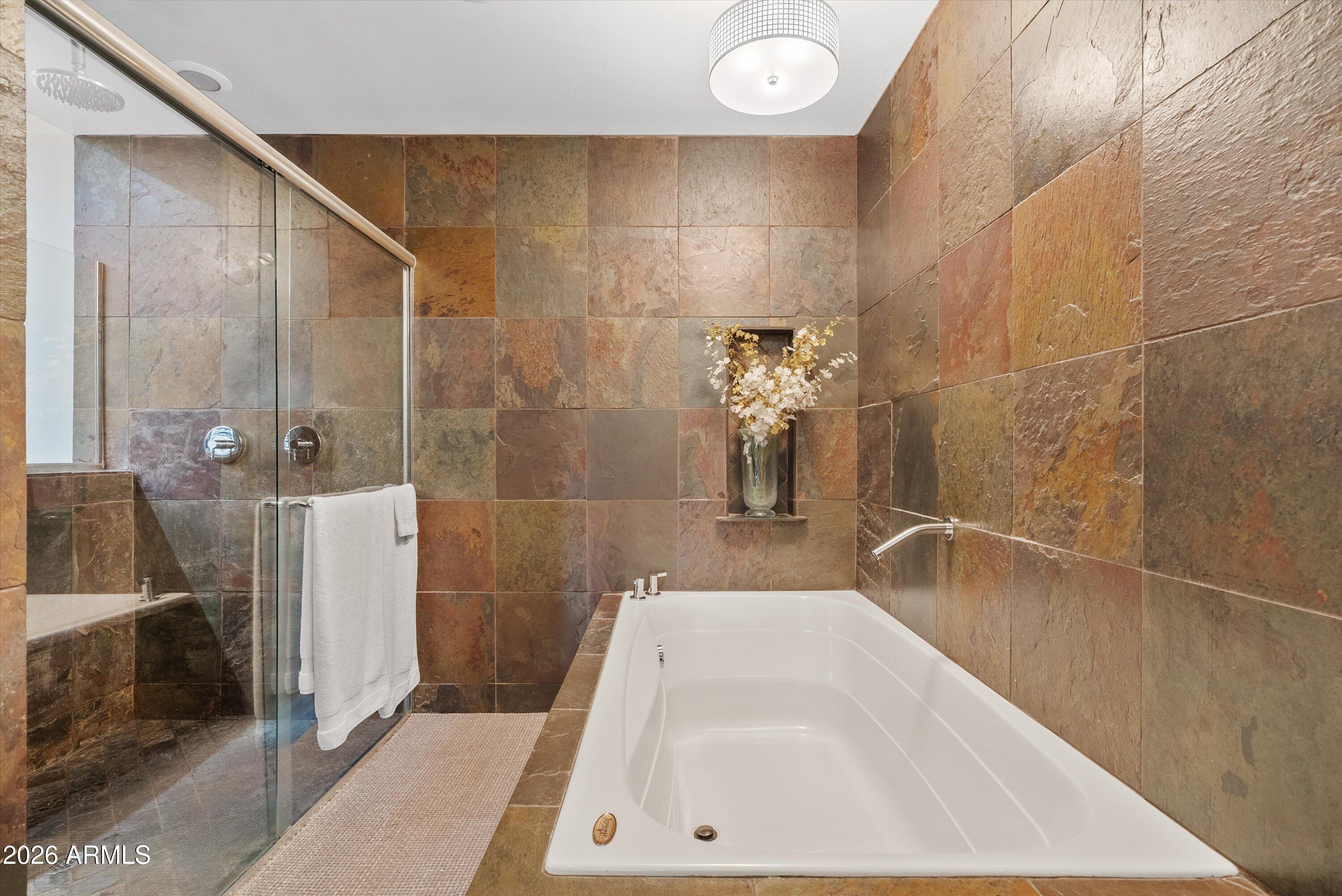 2933 East Pierson Street Phoenix, AZ 85016 - Photo 14 of 28 a bathroom with a bathtub and a shower