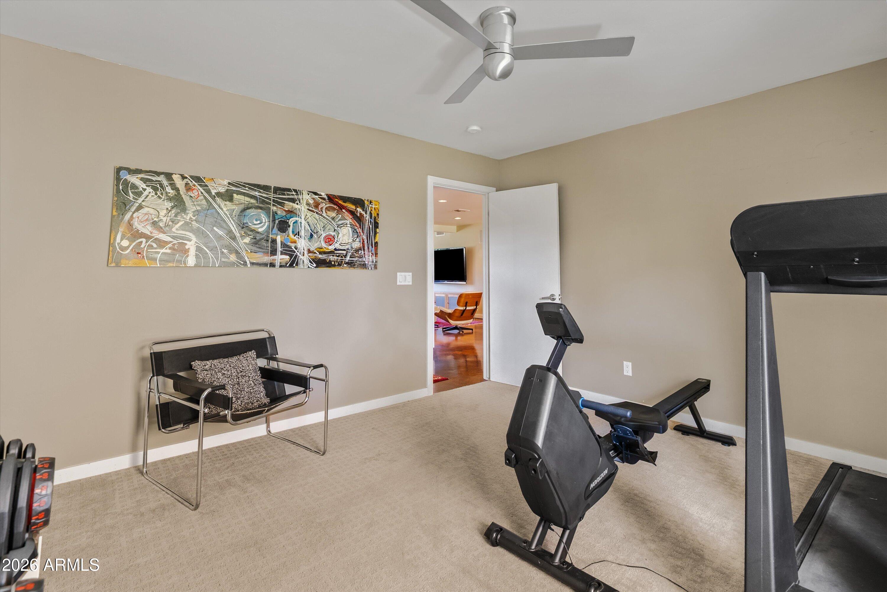 2933 East Pierson Street Phoenix, AZ 85016 - Photo 17 of 28 a view of a workspace with furniture and a window