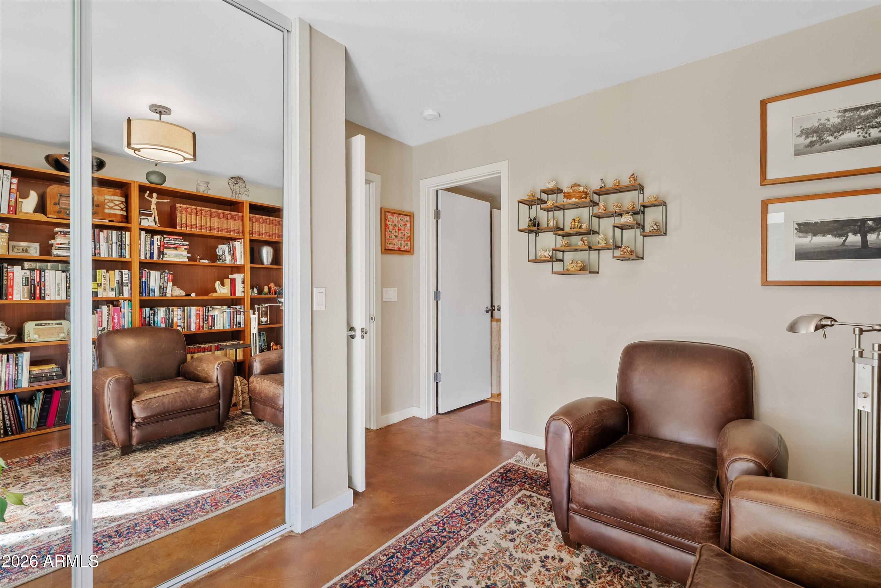 2933 East Pierson Street Phoenix, AZ 85016 - Photo 19 of 28 a living room with furniture and a book shelf