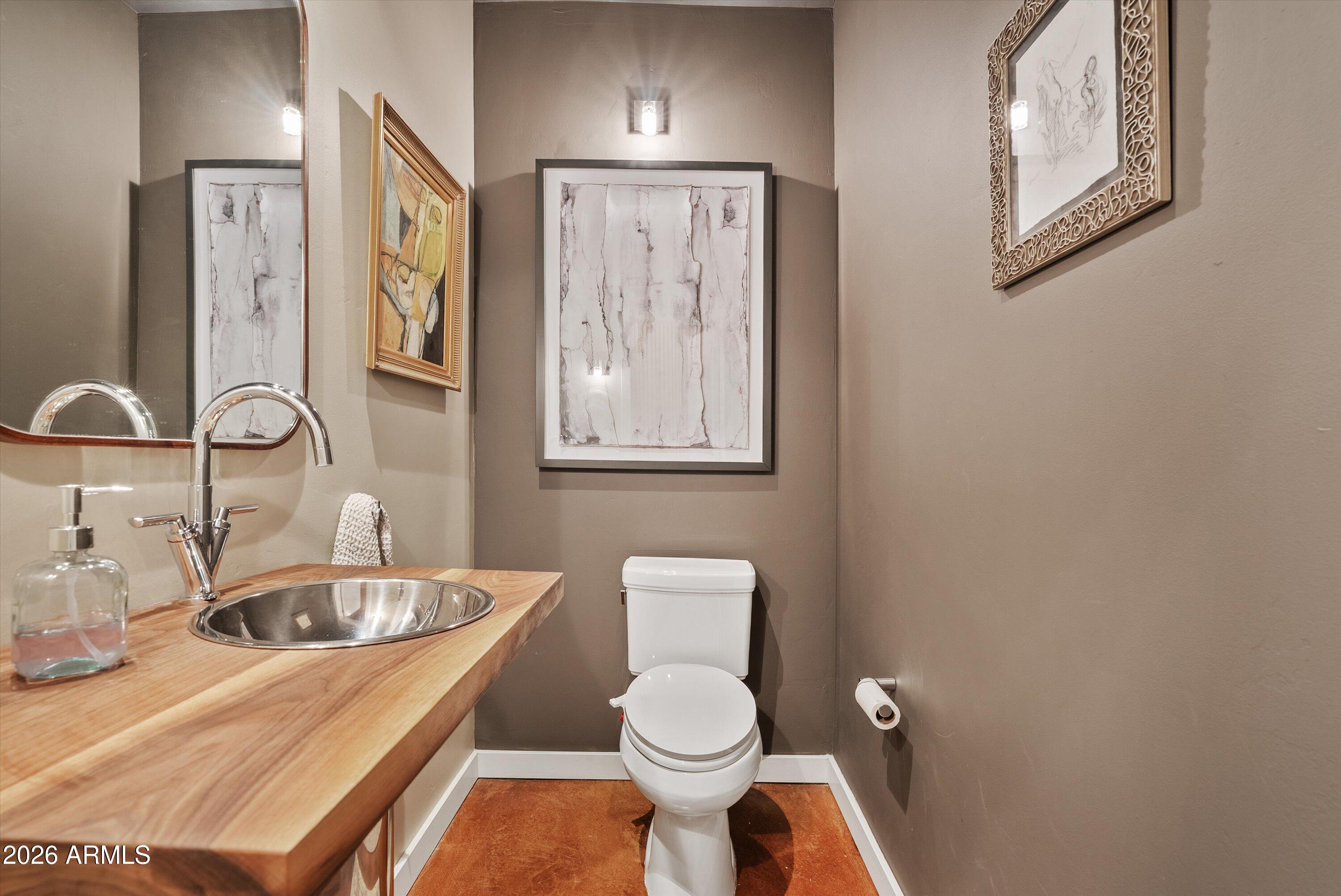 2933 East Pierson Street Phoenix, AZ 85016 - Photo 20 of 28 a bathroom with a sink a toilet and mirror