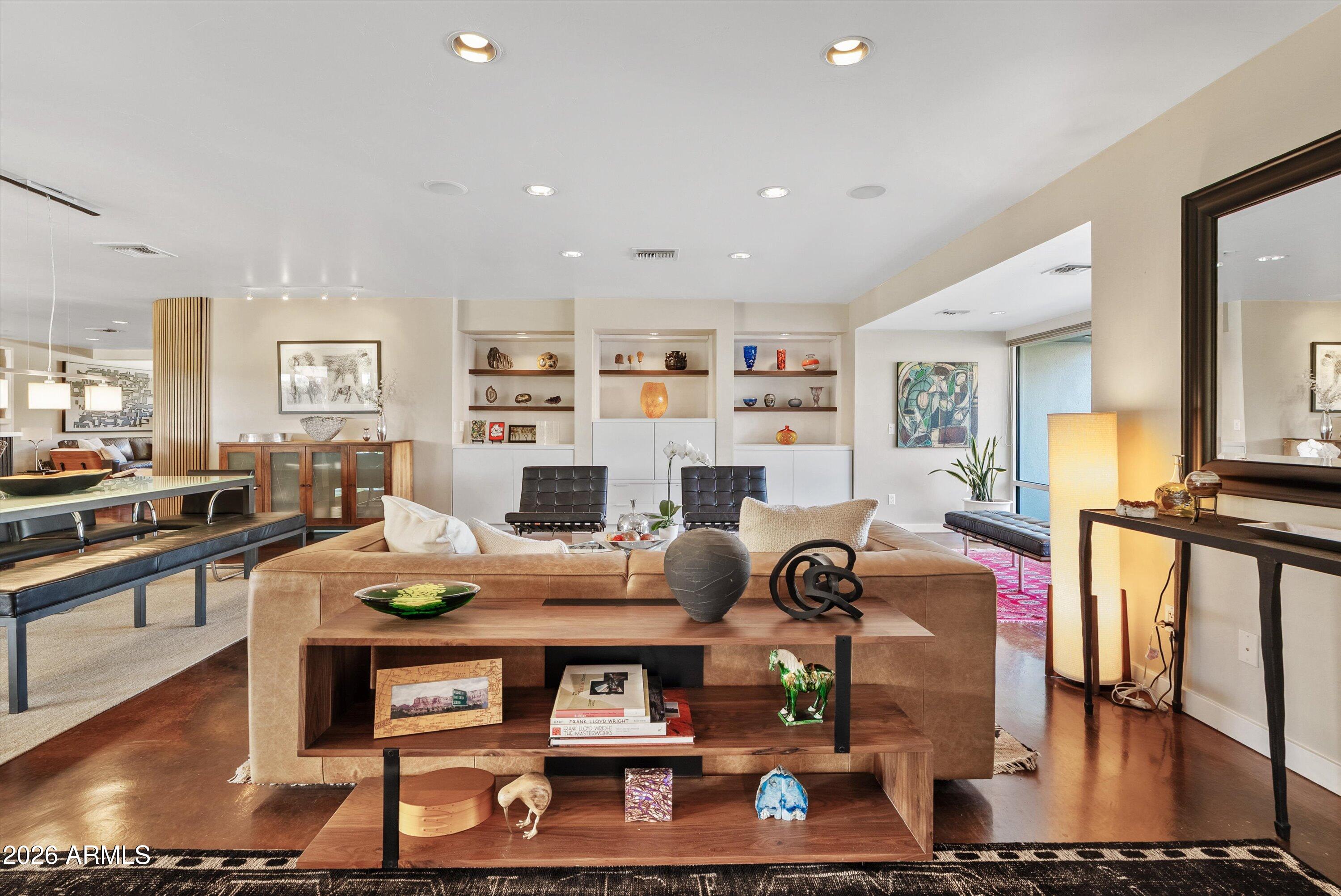 2933 East Pierson Street Phoenix, AZ 85016 - Photo 3 of 28 a living room with furniture a flat screen tv and kitchen view