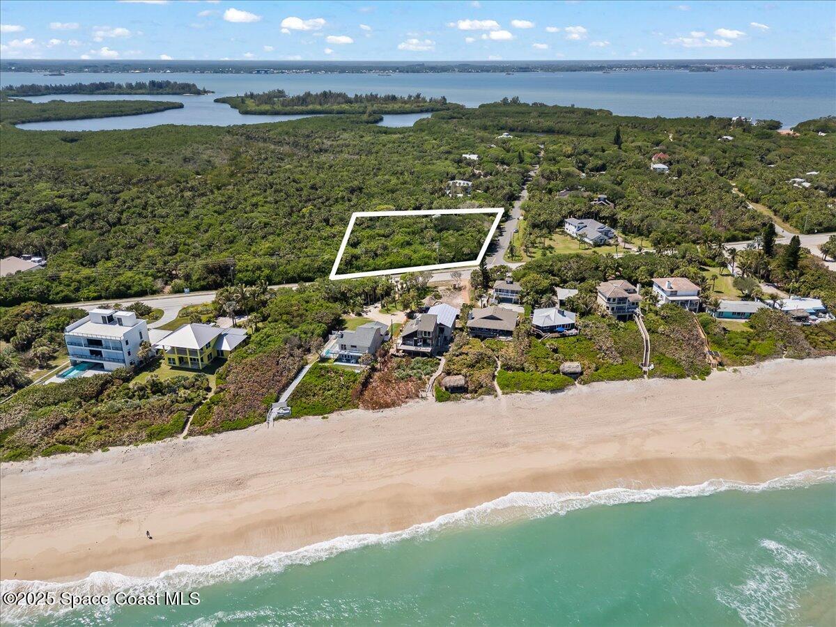101 Seagrape Road Melbourne Beach, FL 32951 - Photo 2 of 19 01-DJI_00571