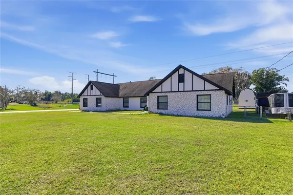 a front view of house with yard and green space