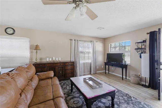 a living room with furniture and a window