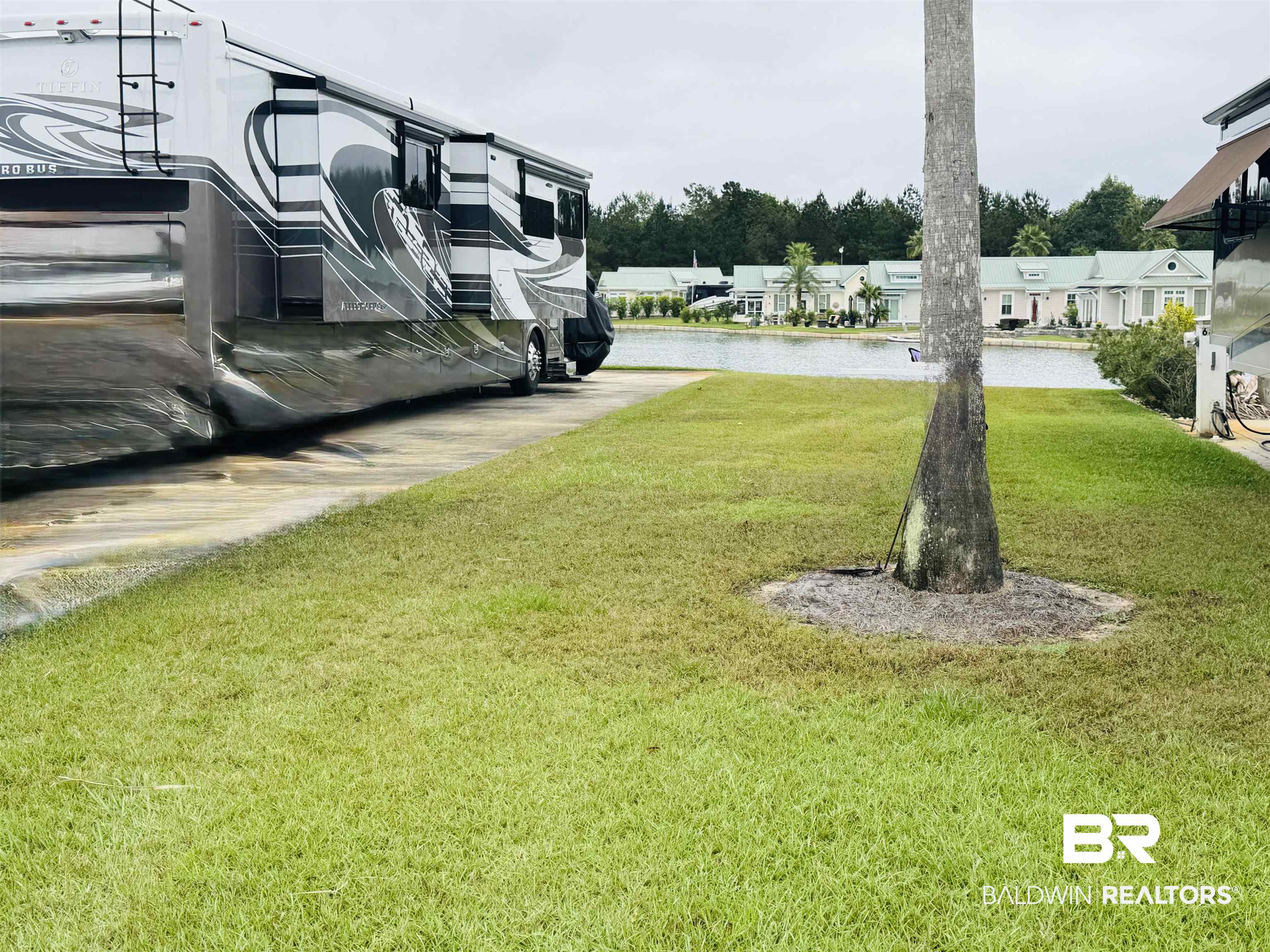 11986 Raptor Court Elberta, AL 36530 - Photo 6 of 28 View of green lawn featuring a water view