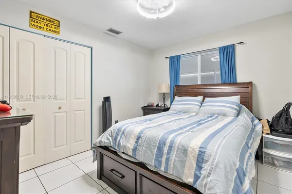 a bedroom with a bed and a cabinets