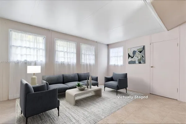 a living room with furniture and windows