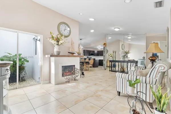 a view of a livingroom with furniture and a fireplace
