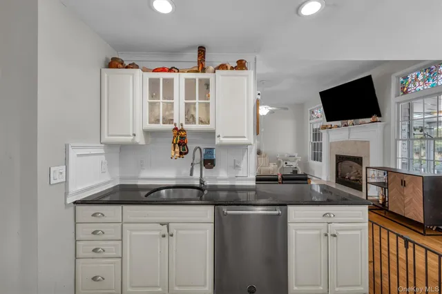 a view of a livingroom with a flat screen tv and a window