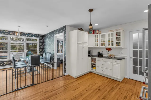 a open kitchen with stainless steel appliances granite countertop a refrigerator and a sink