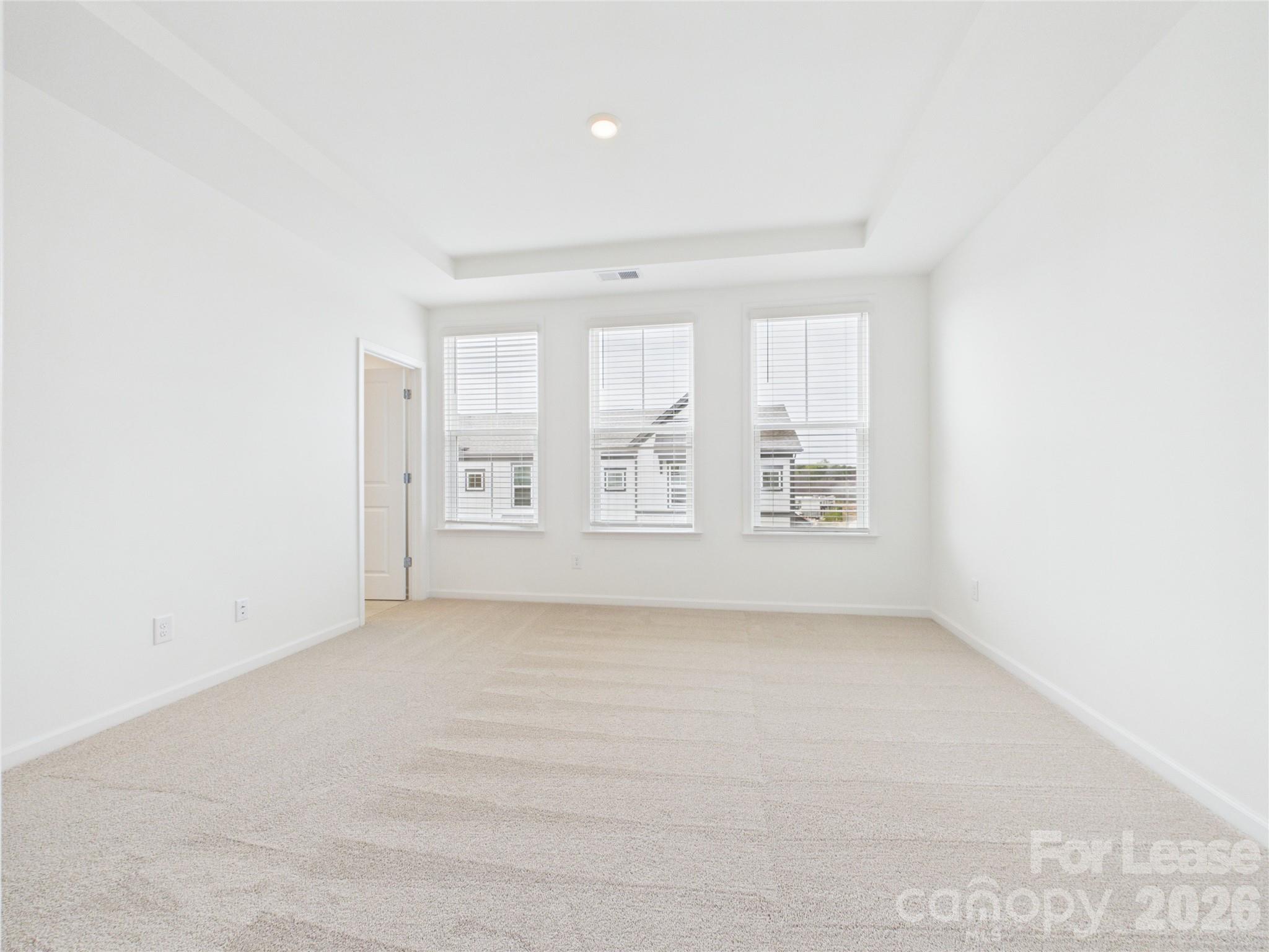3013 Rexton Lane Charlotte, NC 28262 - Photo 13 of 27 a view of an empty room with a window