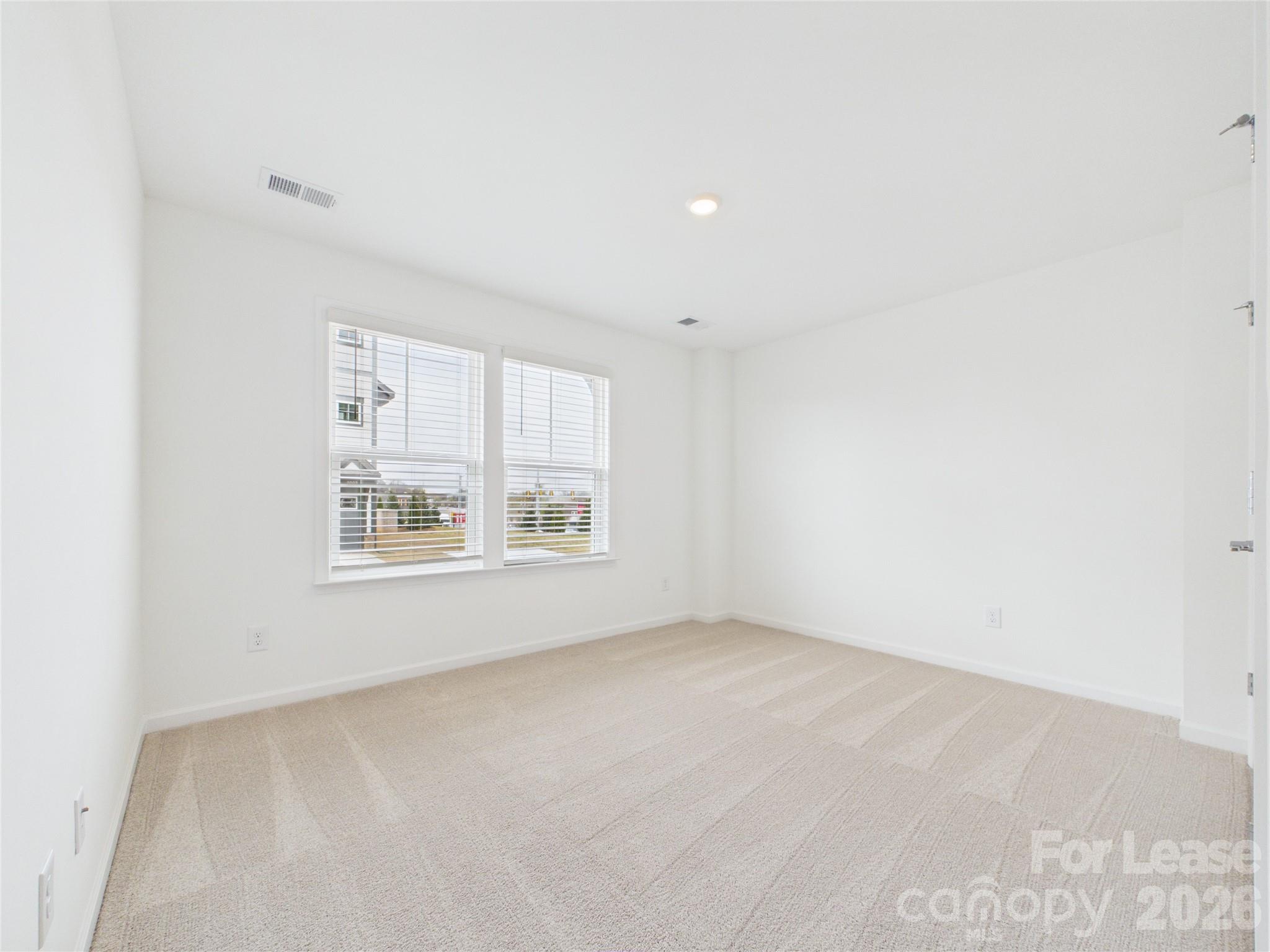 3013 Rexton Lane Charlotte, NC 28262 - Photo 21 of 27 an empty room with a window
