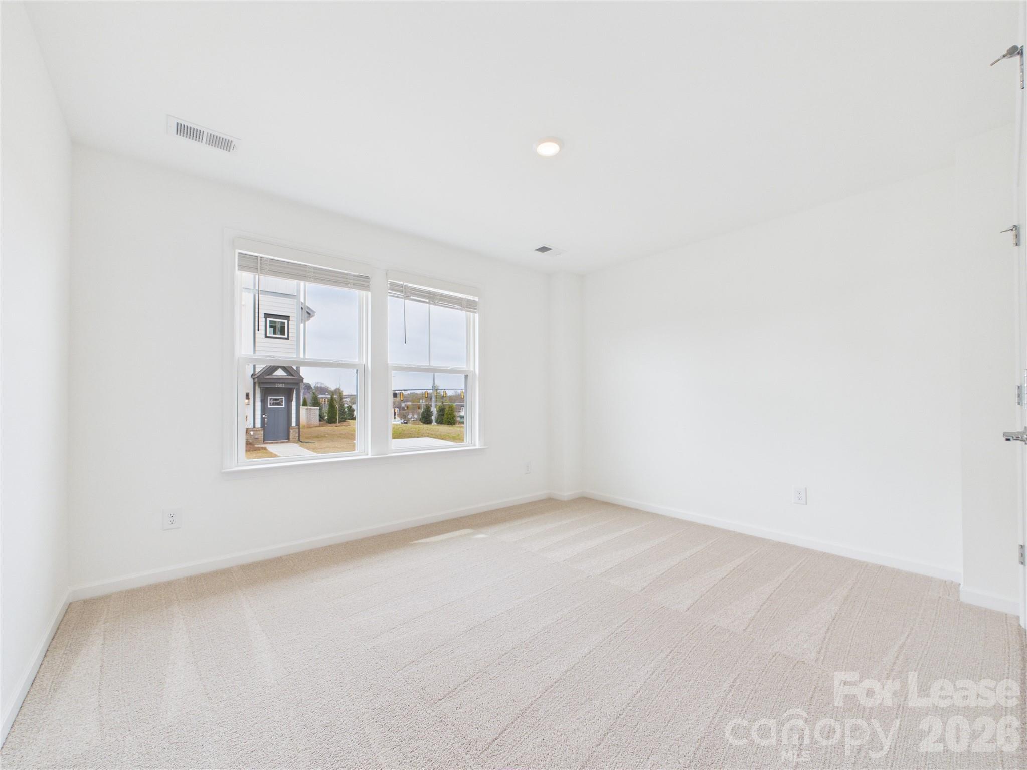 3013 Rexton Lane Charlotte, NC 28262 - Photo 23 of 27 an empty room with windows