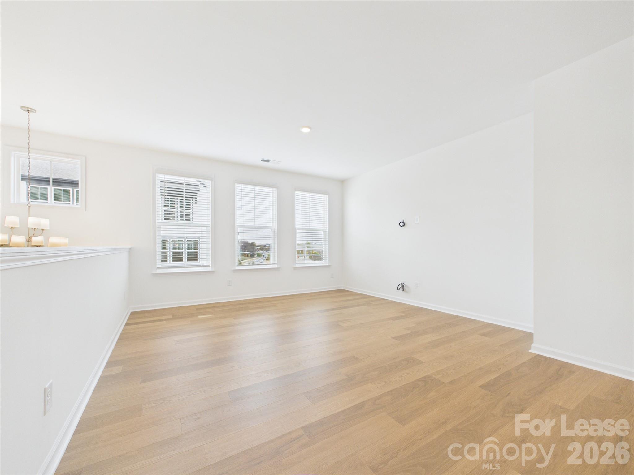 3013 Rexton Lane Charlotte, NC 28262 - Photo 3 of 27 a view of an empty room with a window