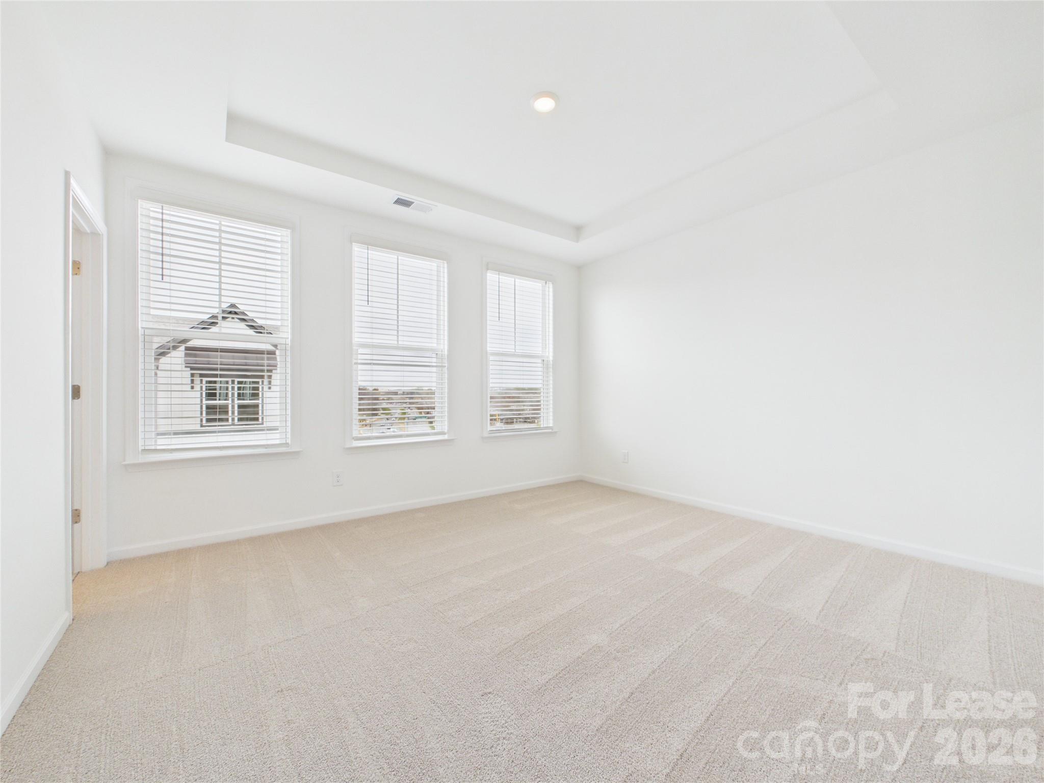 3013 Rexton Lane Charlotte, NC 28262 - Photo 10 of 27 an empty room with windows