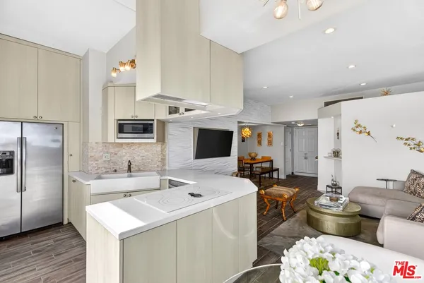a kitchen with a sink dishwasher stove and refrigerator