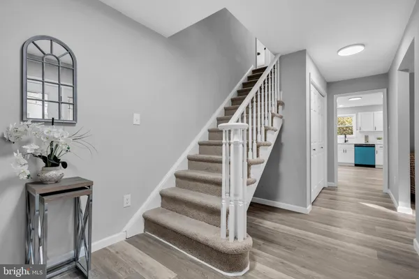 a view of staircase with wooden floor and staircase