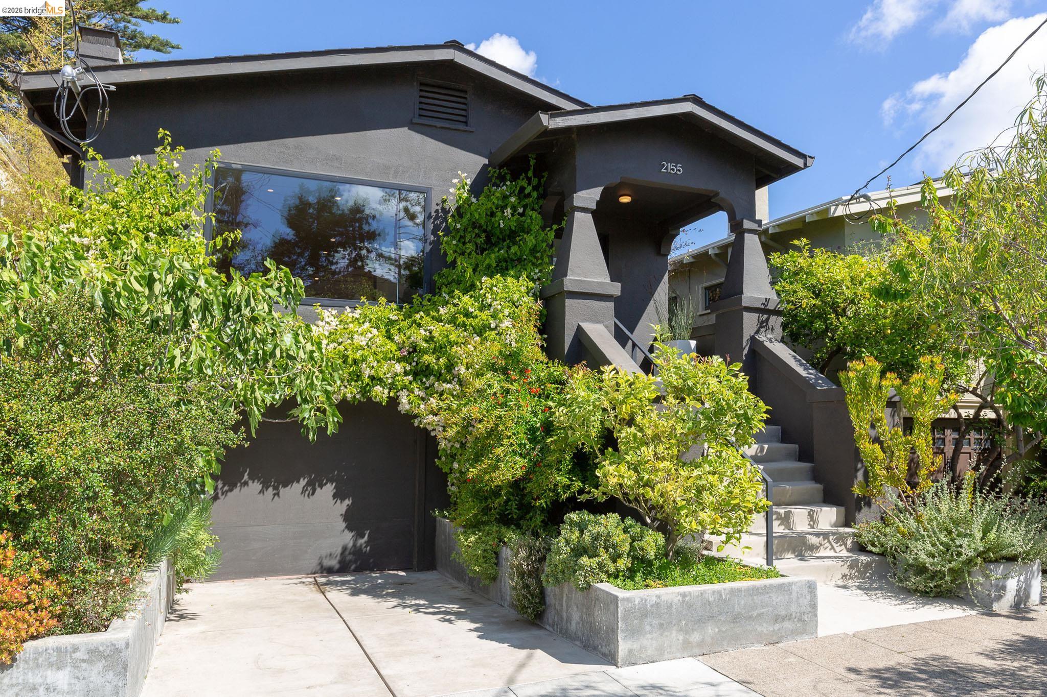 2155 Emerson Street Berkeley, CA 94705 - Photo 1 of 1 a front view of a house with a yard