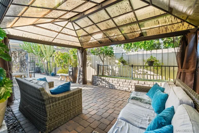 a outdoor living space with patio furniture and garden view