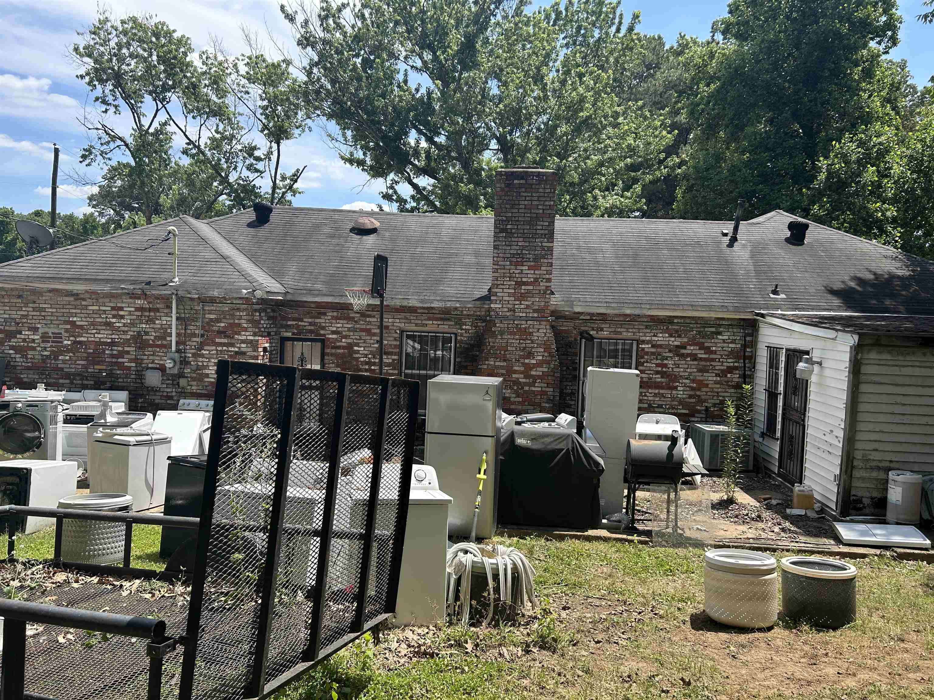 2506 James Road Memphis, TN 38127 - Photo 2 of 3 a view of a patio with table and chairs potted plants with wooden fence