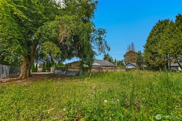 a view of a swimming pool with a yard