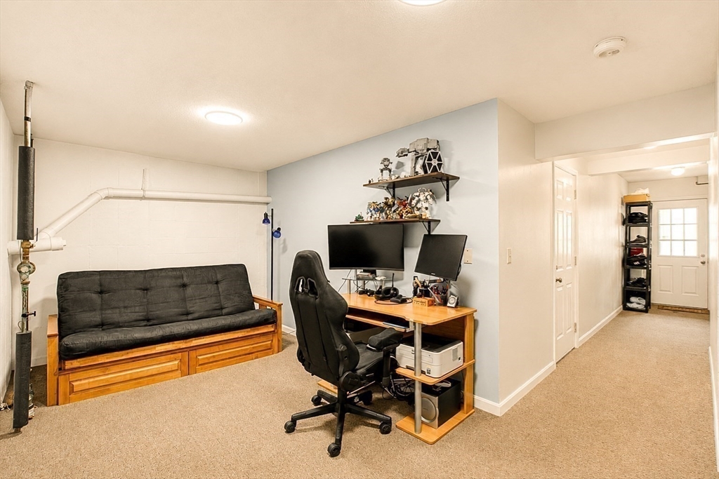 53 Century Way, Unit 53 Gardner, MA 01440 - Photo 20 of 22 a bedroom with furniture and a window