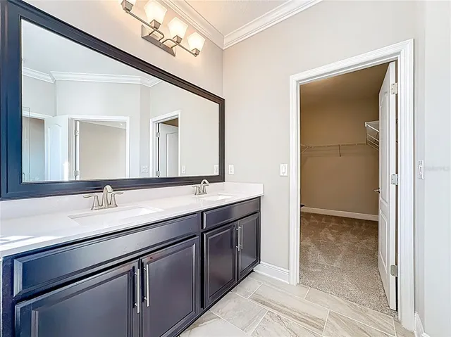 an entryway in a hallway with wooden floor