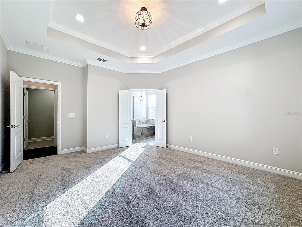 2894 Sand Oak Loop Apopka, FL 32712 - Photo 16 of 69 a view of a livingroom with a chandelier fan and wooden floor