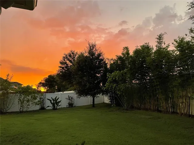 a kitchen with granite countertop a stove and cabinets