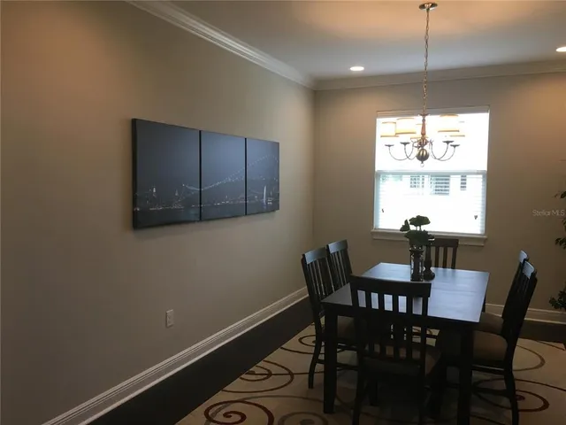 a front view of house with yard and outdoor seating