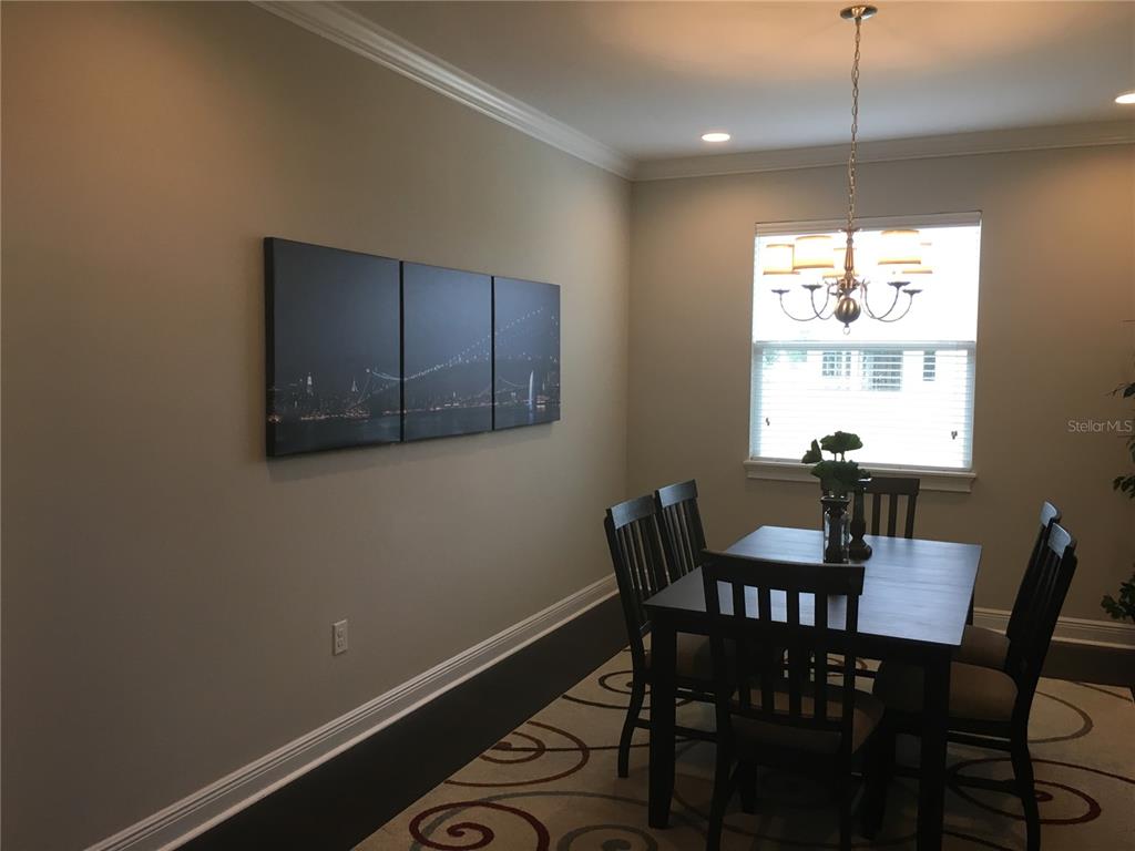 2894 Sand Oak Loop Apopka, FL 32712 - Photo 21 of 69 a view of a dining room with furniture window and outside view
