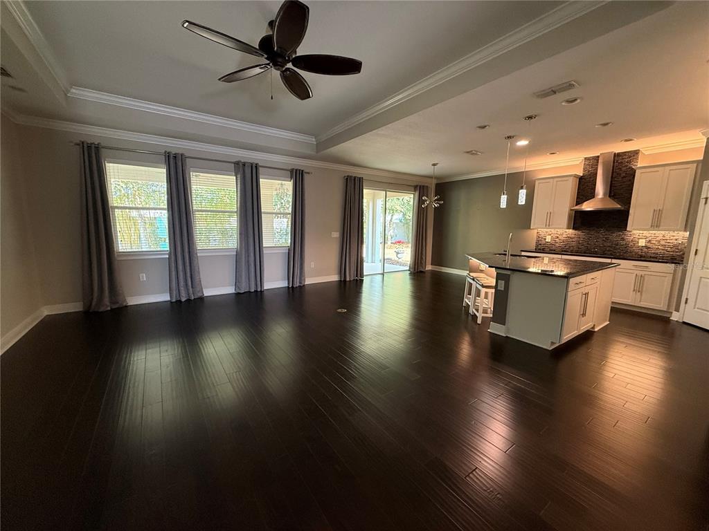 2894 Sand Oak Loop Apopka, FL 32712 - Photo 23 of 69 a view of a livingroom with furniture wooden floor and a ceiling fan