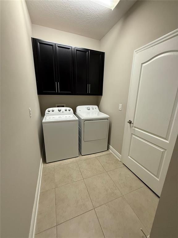 2894 Sand Oak Loop Apopka, FL 32712 - Photo 25 of 69 a utility room with washer and dryer
