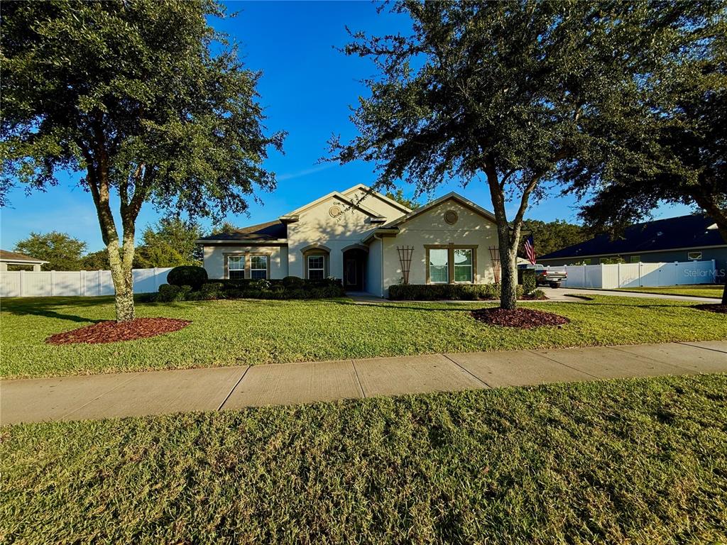 2894 Sand Oak Loop Apopka, FL 32712 - Photo 29 of 69 a front view of a house with a yard