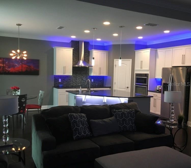 2894 Sand Oak Loop Apopka, FL 32712 - Photo 5 of 69 a living room with furniture and a flat screen tv