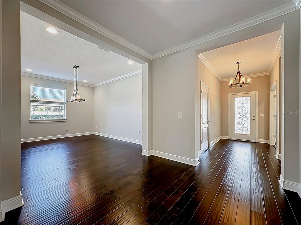 2894 Sand Oak Loop Apopka, FL 32712 - Photo 64 of 69 wooden floor in an empty room with a window