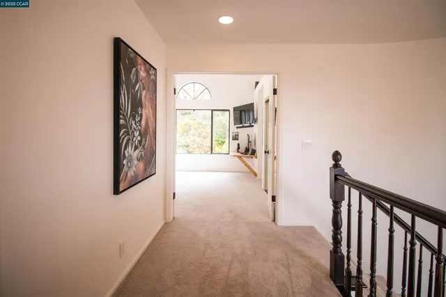 a view of a hallway with windows