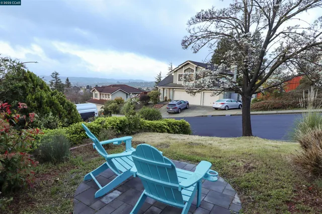 a dining room with furniture a chandelier and wooden floor