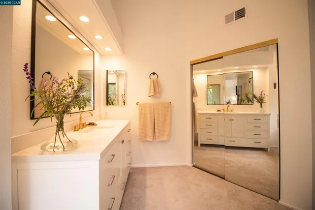 a living room with a large window and a flat screen tv