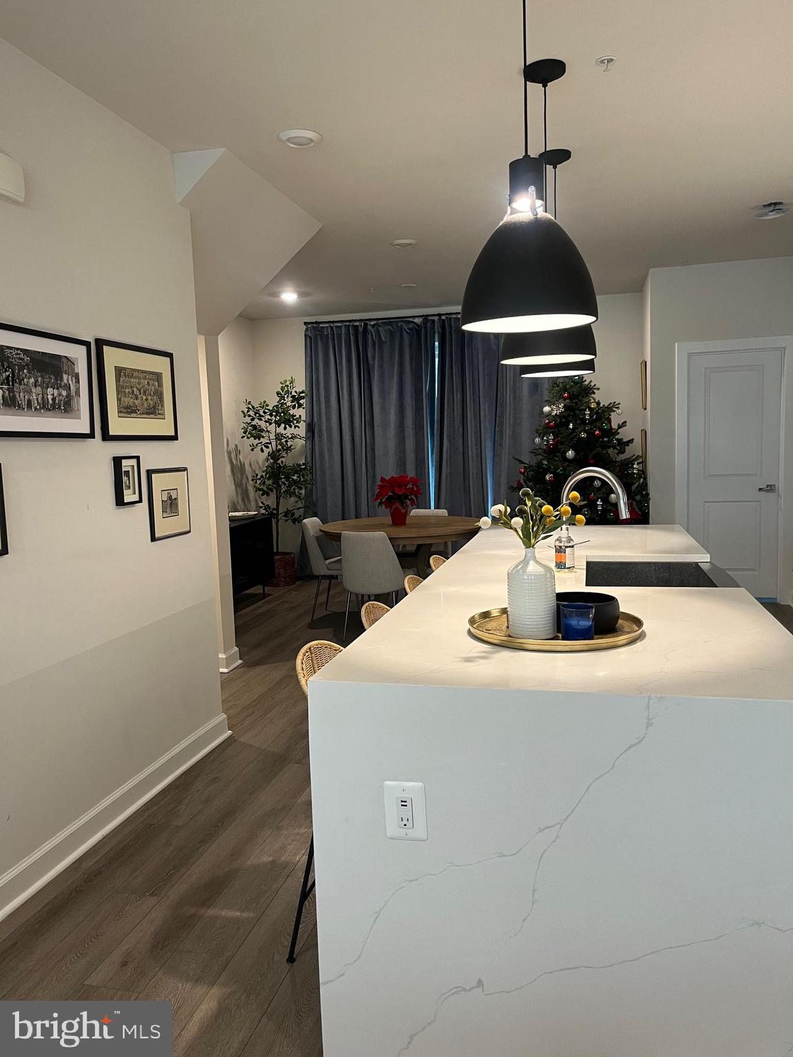 209 Market Square Northwest, Unit 17 Vienna, VA 22180 - Photo 6 of 26 a kitchen with a sink a counter space and a view of living room