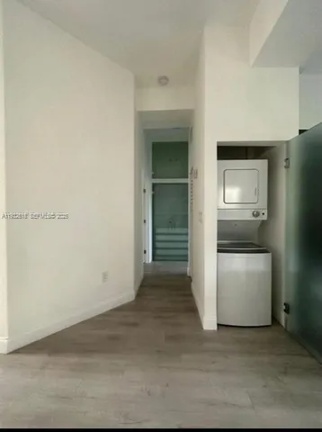 a view of a utility room with a hallway