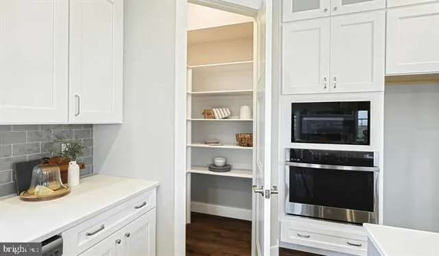 a kitchen with a stove and cabinets