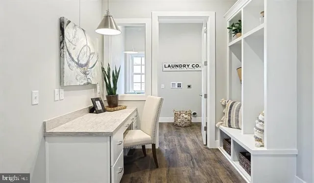 a view of living room with furniture and wooden floor
