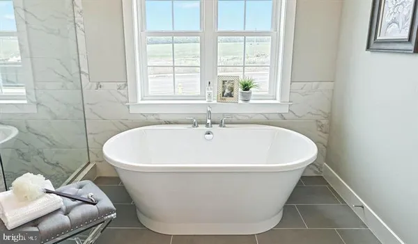 a white bath tub sitting in a bathroom
